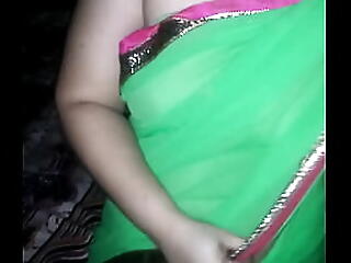 Shonali dressed tiny connected with green sari
